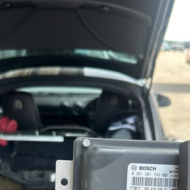 Porsche engine control unit during repair