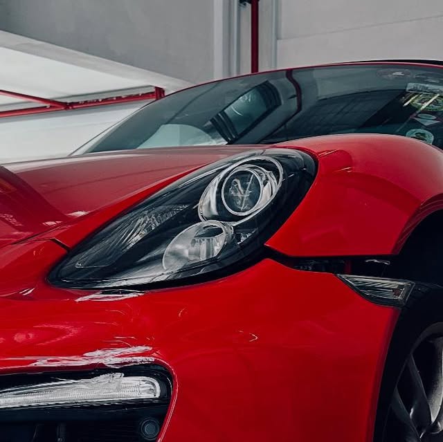 Red Porsche documented during an accident-claim assessment