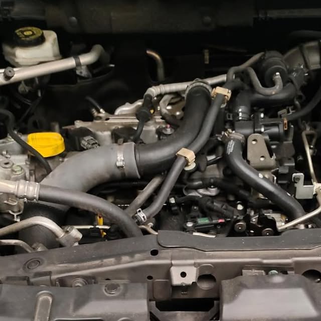Nissan Qashqai engine bay during oil-leak and maintenance work