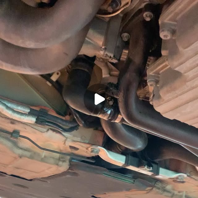 Underside of a Porsche 981 during coolant-leak inspection