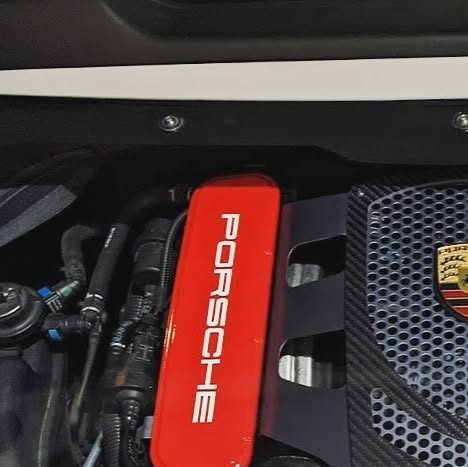 Porsche engine viewed through a clear display cover